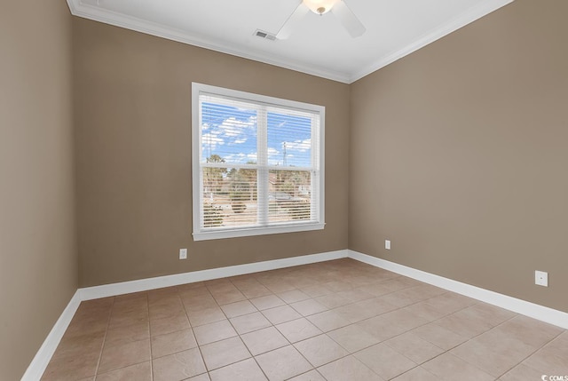 spare room with visible vents, baseboards, a ceiling fan, and ornamental molding