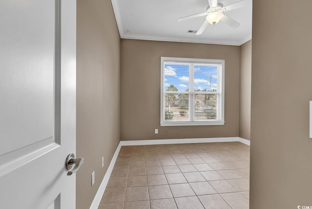 empty room featuring crown molding, light tile patterned flooring, baseboards, and ceiling fan