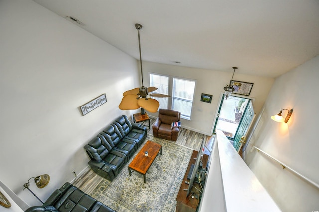 living area with wood finished floors and baseboards