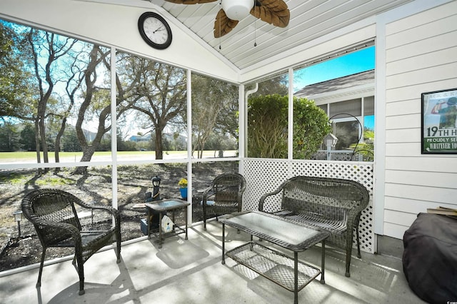 sunroom / solarium featuring ceiling fan and lofted ceiling