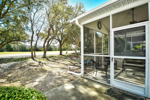 view of patio with a sunroom