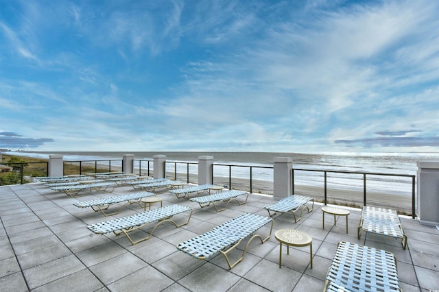 view of patio featuring a water view