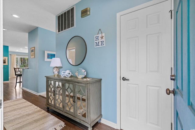 entrance foyer featuring recessed lighting, visible vents, baseboards, and dark wood-type flooring