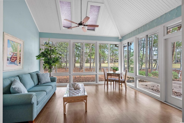 sunroom featuring ceiling fan and vaulted ceiling