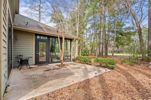 view of patio with a sunroom