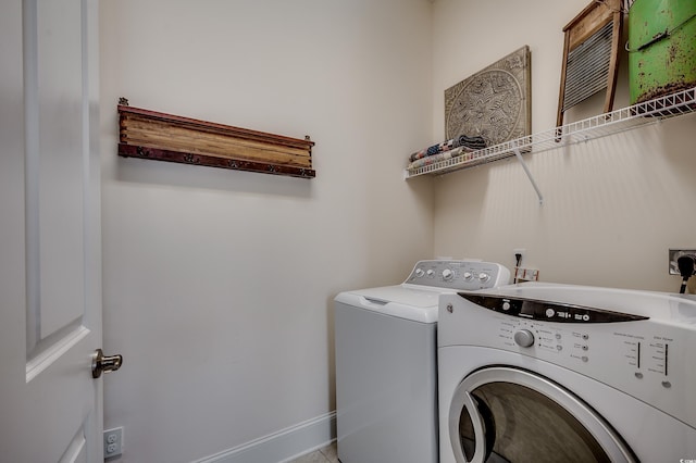 laundry area with washing machine and dryer and laundry area