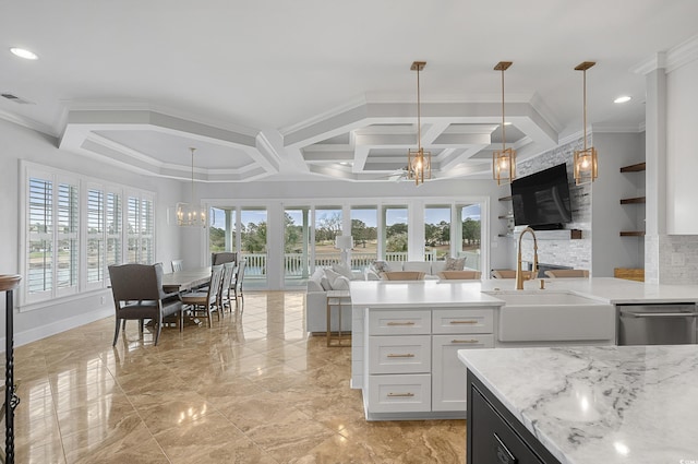 kitchen with a notable chandelier, a healthy amount of sunlight, open floor plan, and a sink