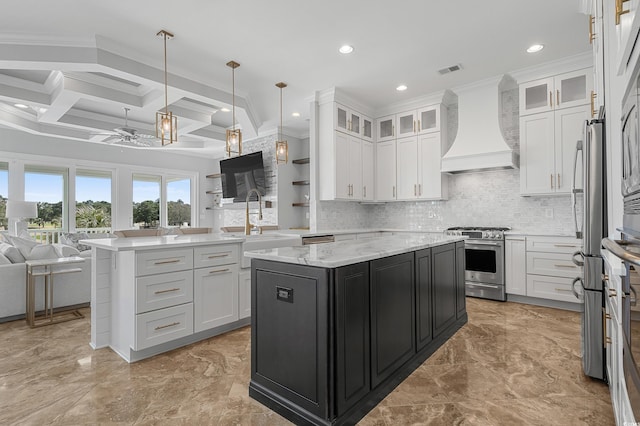 kitchen featuring a kitchen island, open floor plan, stainless steel stove, custom exhaust hood, and marble finish floor