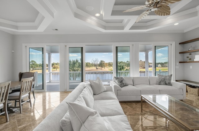 living area featuring visible vents, a healthy amount of sunlight, a ceiling fan, and ornamental molding