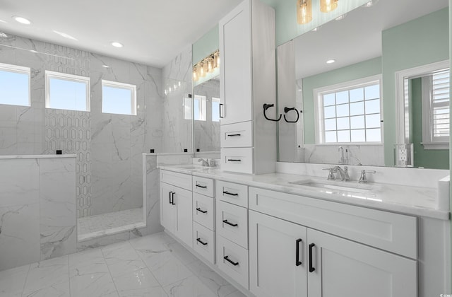 full bath featuring a sink, a marble finish shower, marble finish floor, and recessed lighting