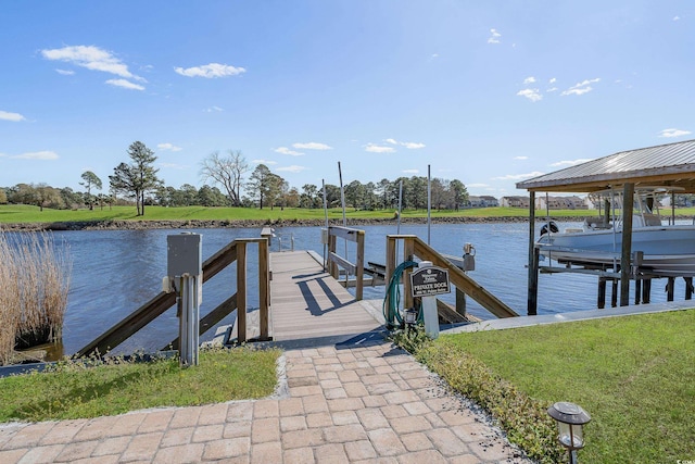 dock area with boat lift and a water view