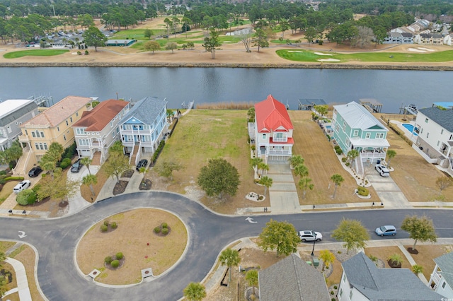 bird's eye view with a residential view and a water view