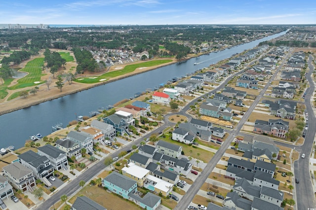 birds eye view of property featuring a water view and a residential view