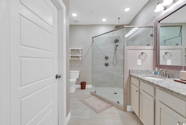 full bathroom with a shower stall, baseboards, toilet, recessed lighting, and vanity