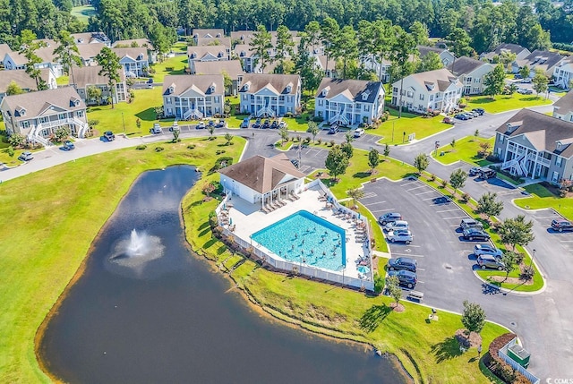 bird's eye view with a water view and a residential view