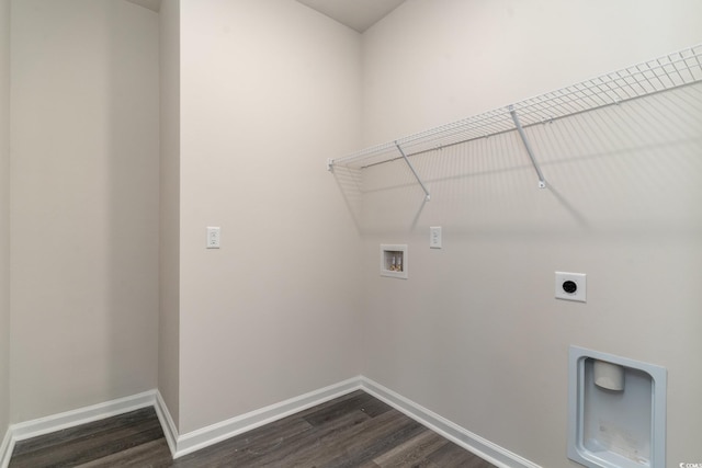 clothes washing area with washer hookup, electric dryer hookup, dark wood-type flooring, and baseboards