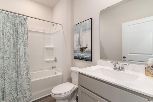 bathroom with vanity, toilet, and shower / bath combo