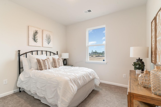 carpeted bedroom with baseboards