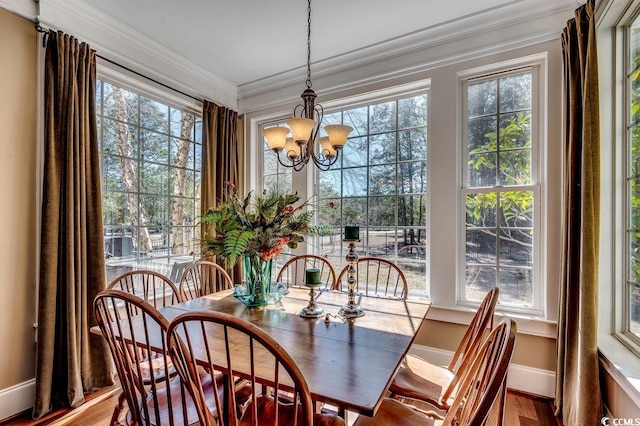 1539 Old Town Ave, Georgetown, SC 29440 - dining area with a chandelier, ornamental molding, and wood finished floors
