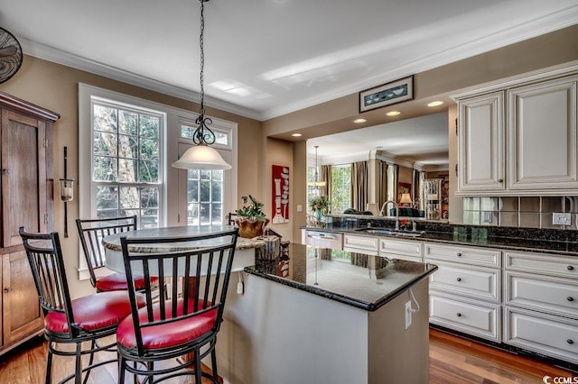 1539 Old Town Ave, Georgetown, SC 29440 - kitchen with ornamental molding, a center island, dishwasher, healthy amount of natural light, and dark wood finished floors