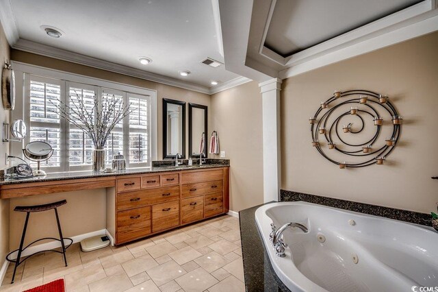 full bath featuring baseboards, visible vents, double vanity, a whirlpool tub, and ornamental molding