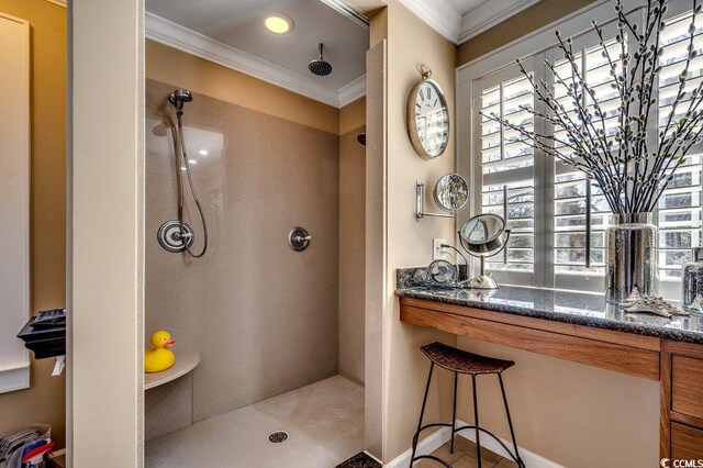 bathroom with crown molding and walk in shower