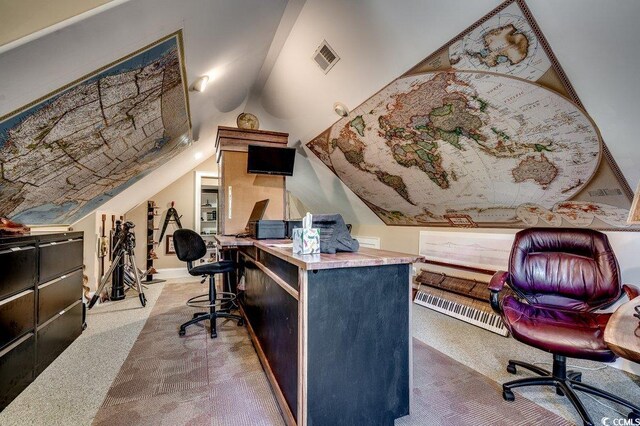 carpeted office with lofted ceiling and visible vents