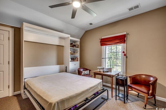 carpeted bedroom featuring a ceiling fan, vaulted ceiling, baseboards, and visible vents