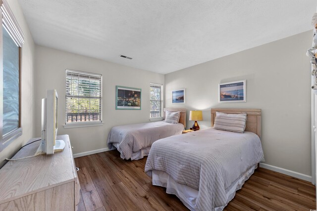 270 Pinehurst Ln Unit 9G, Pawleys Island, SC 29585 - bedroom with wood finished floors and baseboards