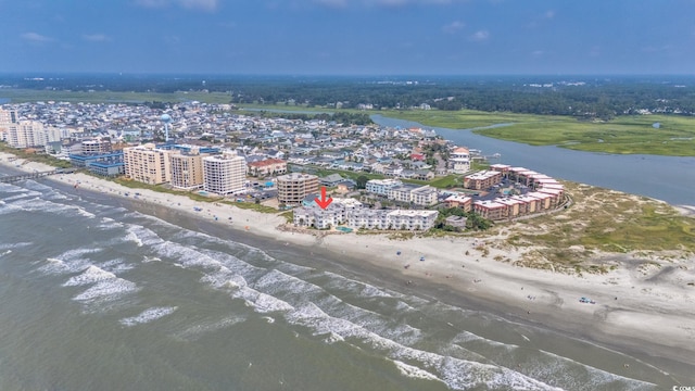 bird's eye view featuring a water view, a view of city, and a view of the beach