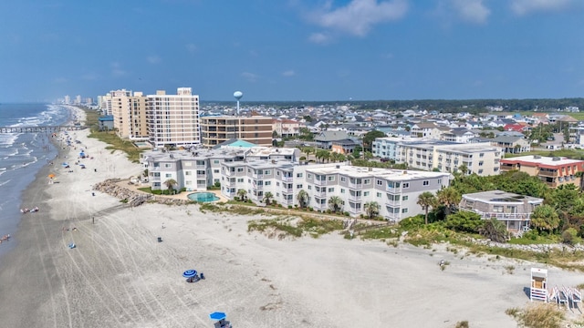 aerial view with a city view, a beach view, and a water view