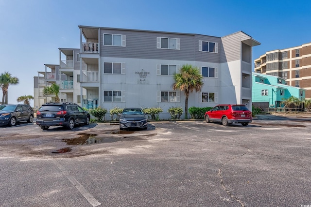 view of property with uncovered parking