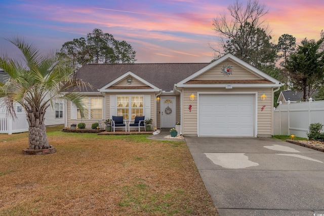 single story home with driveway, a shingled roof, fence, a front yard, and an attached garage