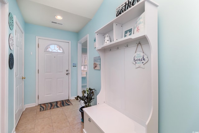 mudroom with light tile patterned flooring and visible vents