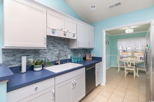 kitchen with visible vents, light tile patterned flooring, a sink, appliances with stainless steel finishes, and tasteful backsplash