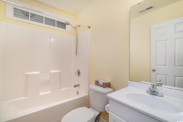 bathroom with visible vents, toilet, bathtub / shower combination, and vanity