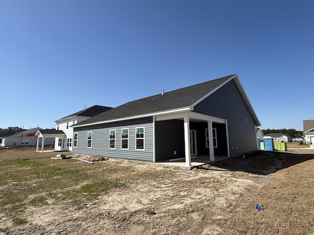 back of house with a patio area