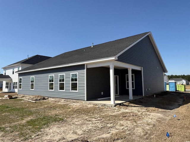 back of house with a patio