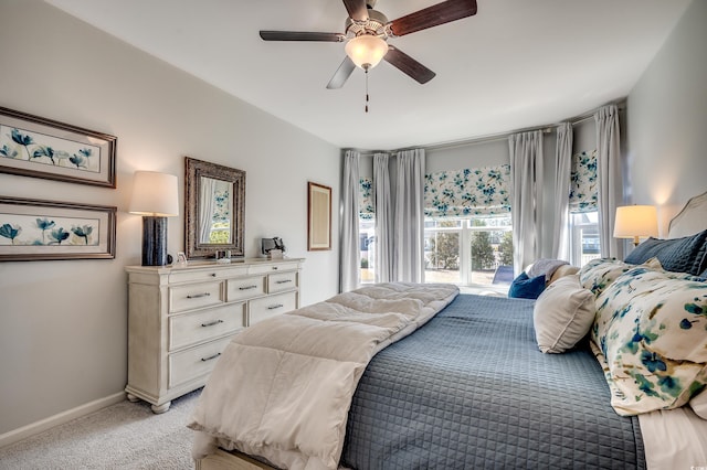 bedroom with baseboards, light carpet, and a ceiling fan