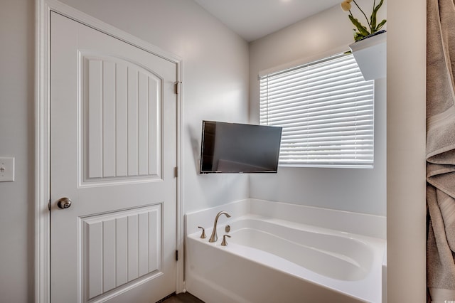 bathroom featuring a bath