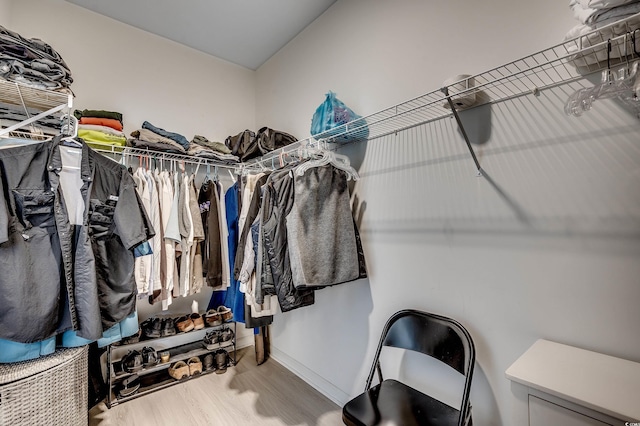 spacious closet with wood finished floors