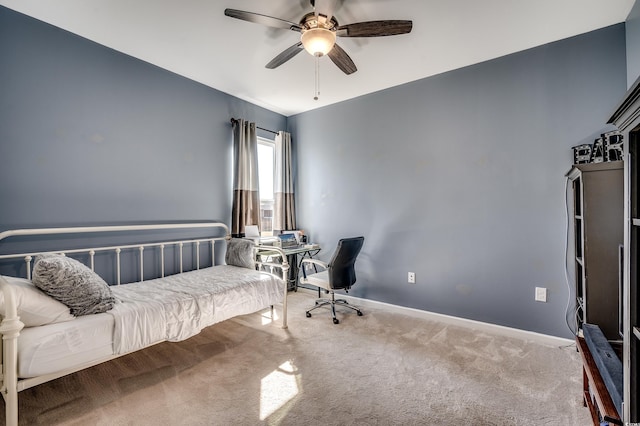 bedroom with baseboards, a ceiling fan, and carpet flooring