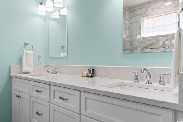 full bath with a sink and double vanity