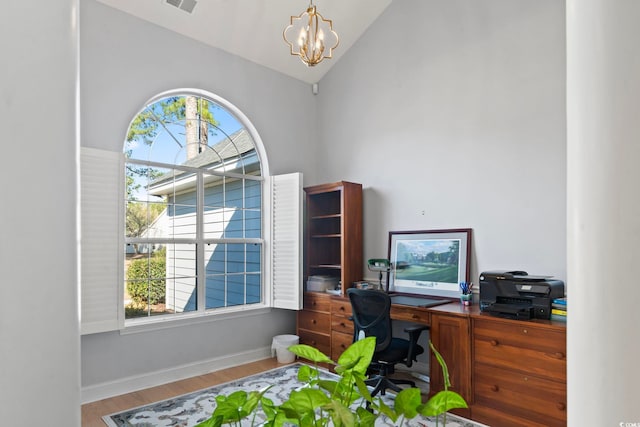 office featuring visible vents, baseboards, wood finished floors, a notable chandelier, and high vaulted ceiling