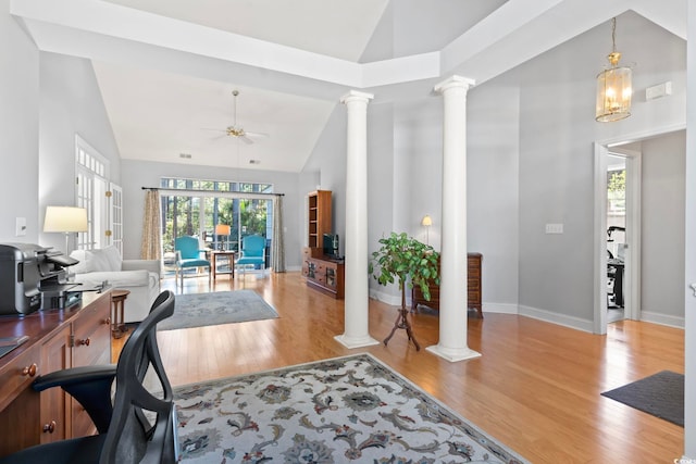 office featuring wood finished floors, ornate columns, and ceiling fan