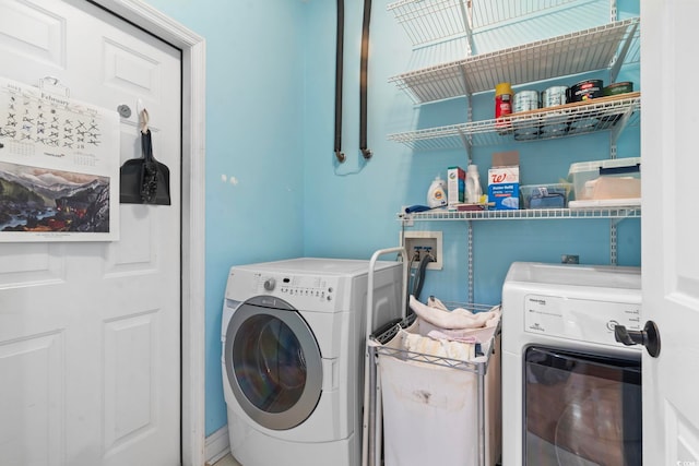 laundry room with laundry area and separate washer and dryer