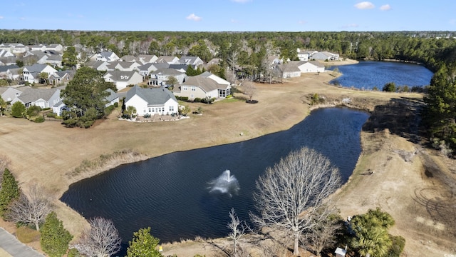 bird's eye view featuring a residential view and a water view