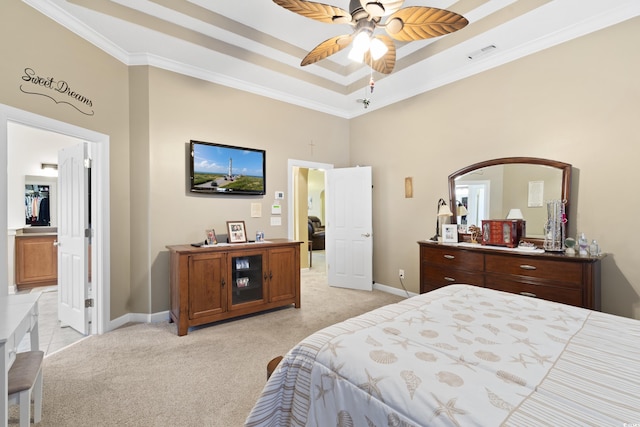 bedroom featuring visible vents, crown molding, baseboards, light carpet, and a raised ceiling