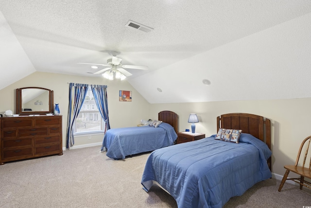 carpeted bedroom featuring visible vents, a textured ceiling, ceiling fan, and vaulted ceiling