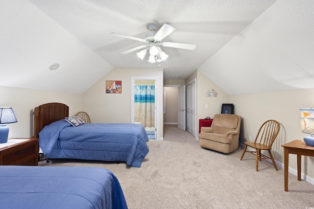 bedroom featuring baseboards, carpet floors, ceiling fan, vaulted ceiling, and a textured ceiling